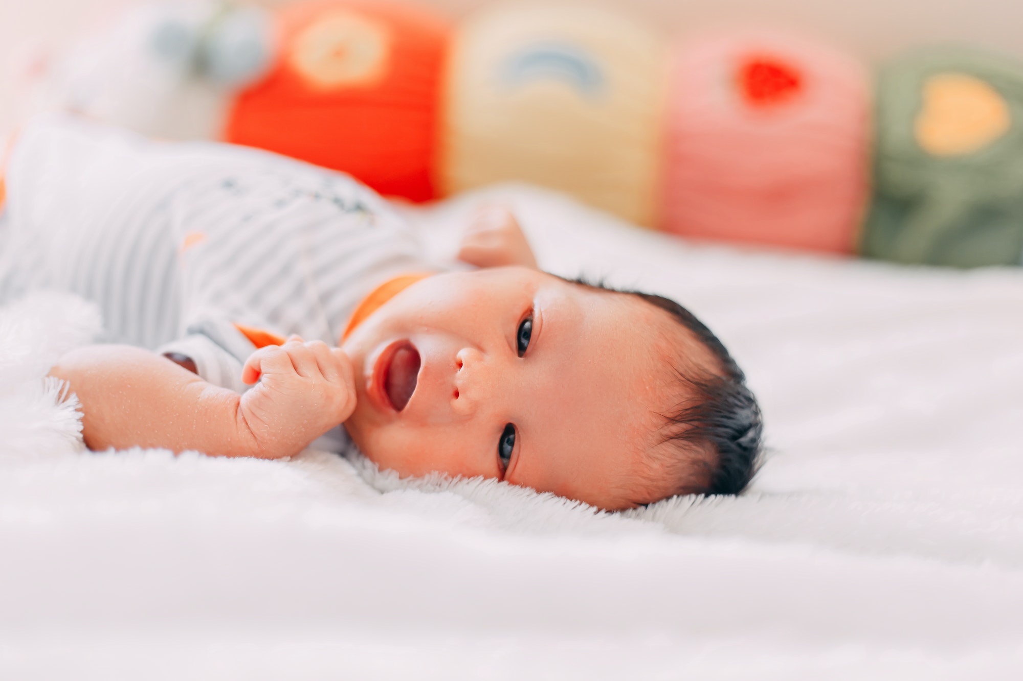 premature newborn baby looking at camera